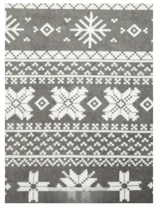 Gros plan d'un tissu en flanelle grise avec des motifs de flocons de neige et nordiques