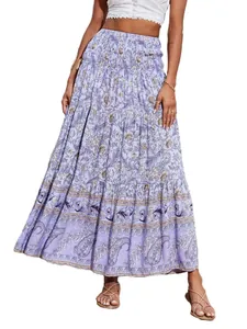 Close-up of bohemian floral print maxi skirt with tiered hem and smocked high waist