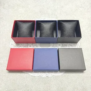 Detailed view of red, blue, and black striped watch gift boxes with interior pillows.
