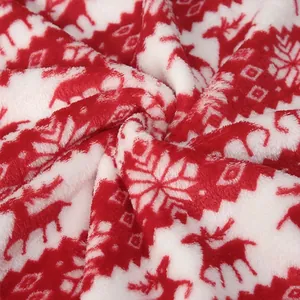 Red and white Christmas flannel fabric with reindeer and snowflake patterns