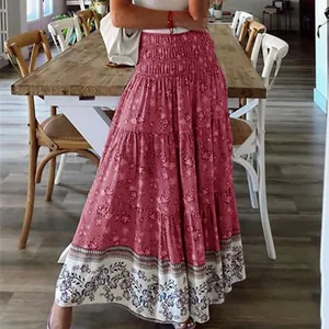 Bohemian style pink floral high waist tiered maxi skirt featuring a detailed ethnic border