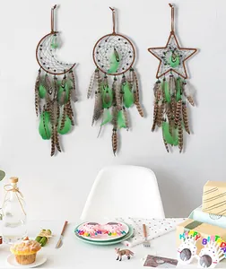 Forest style moon and star dreamcatchers hanging in a bedroom birthday setting.