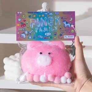 Close-up of a pink pig squishy toy in colorful pixel art packaging for stress relief