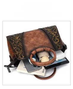 Detailed view of the internal capacity of the floral embossed retro leather bag