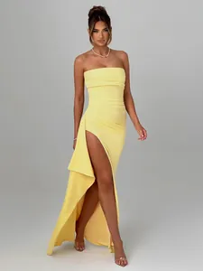 Elegant yellow strapless maxi dress with a sexy high side slit and draped detail