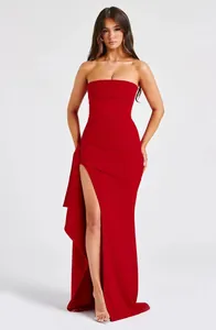 Sexy red strapless maxi dress featuring a high side slit and elegant side ruffles.