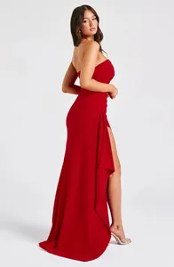 Elegant red strapless maxi dress with high side slit and ruffle detail for events