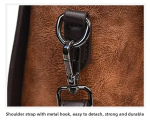 Close-up of durable gunmetal hardware hook on vintage brown leather handbag