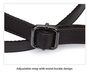 Detailed view of the adjustable brown leather bag strap featuring a dark metal buckle