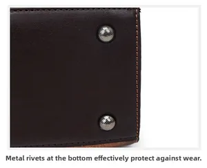 Close-up detail of metal protective rivets on the bottom of a brown leather handbag