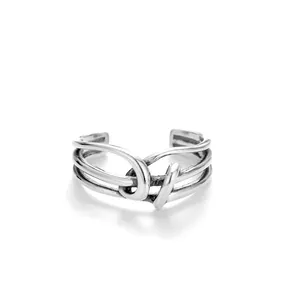 Detail view of retro knotted S925 sterling silver wrap ring with adjustable band