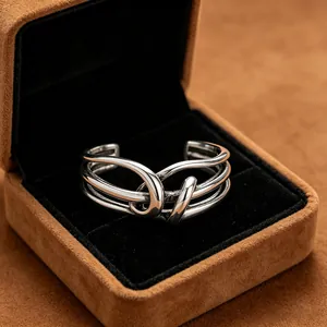 Detail view of antique silver S925 sterling silver knot ring in premium jewelry box