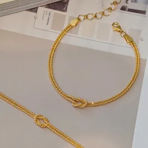 Elegant s925 sterling silver gold-plated double-strand knot bracelet for stylish women.