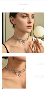 Close-up view of an elegant metallic heart pendant necklace on an Asian model, stylish