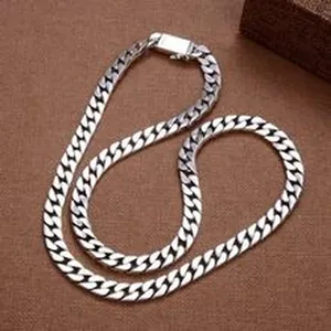 Detailed close-up of a chunky S925 sterling silver curb chain necklace for jewelry.