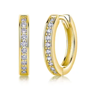 Detailed macro shot of gold plated sterling silver moissanite hoop earrings