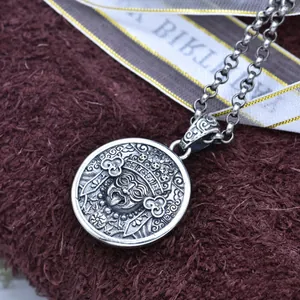 Intricate close-up of a vintage S925 sterling silver Tashi Lhamo deity pendant necklace