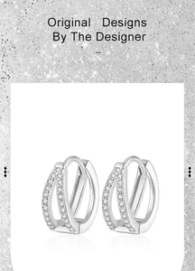 Detail of S925 silver double-layer V-shaped earrings with pavé diamond accents