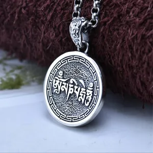 Close-up of S925 sterling silver Tibetan mantra pendant with vintage oxidized finish