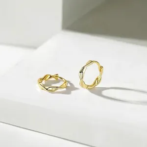 Elegant 925 sterling silver gold Mobius hoop earrings with a minimalist twist design.