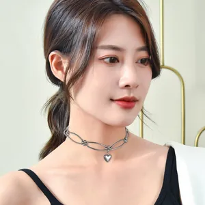 Minimalist metal heart choker necklace for women featuring an elegant oval link design