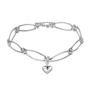 Minimalist silver metal heart pendant choker necklace with bead link design.