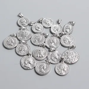 Detailed macro view of multiple vintage silver-tone stainless steel coin pendants with portraits