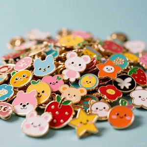 Close-up of colorful cartoon animal and fruit enamel pins with vibrant glossy finish