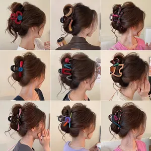 Vibrant collection of large hair claw clips featuring unique shapes and contrast colors