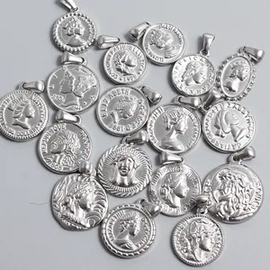 Vintage stainless steel coin pendants featuring various embossed portrait relief designs