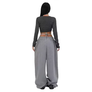 Rear view of comfortable loose grey wide-leg street dance sweatpants with baggy fit