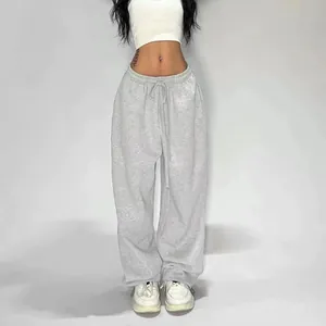Women's baggy grey sweatpants with elastic drawstring waist for street dance style