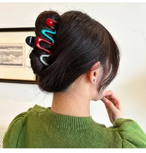 Large shark hair claw clip for women with red and blue wavy color blocking design