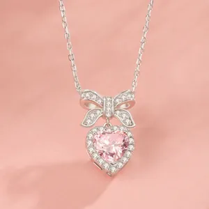 Collana a cuore in argento S925 con gemma rosa e ciondolo a fiocco per donna