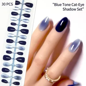 Realistic almond press-on nails with blue cat-eye gradient effect.