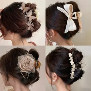 Elegant collection of large hair claw clips with floral, heart and bow designs