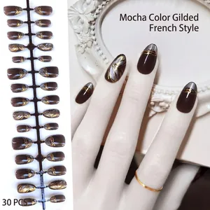 Handmade mocha almond press-on nails with gold foil french tips, 30 pieces set.