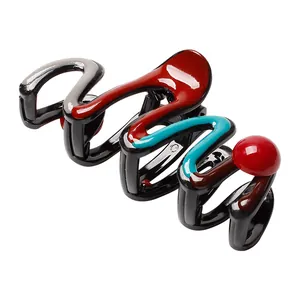 Large glossy artistic shark hair claw clip with red and blue contrast wavy pattern
