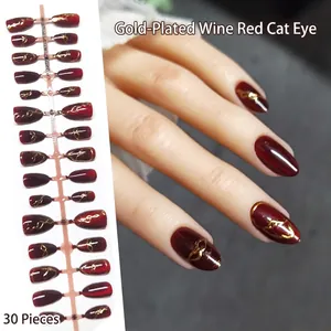 Elegant burgundy cat eye press-on nails with gold wire accents, 30 pieces almond set