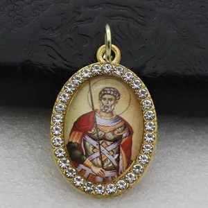 Detailed macro shot of an oval micro-pave religious saint icon pendant charm
