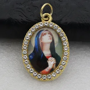 Oval Virgin Mary religious charm pendant featuring micro-set sparkling rhinestones detail