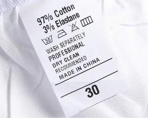 Close-up of fabric composition and care label for men's cotton elastane slim jeans
