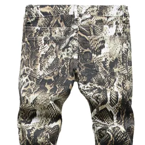 Stylish men's slim fit jeans featuring a bold snake skin pattern in earth tones