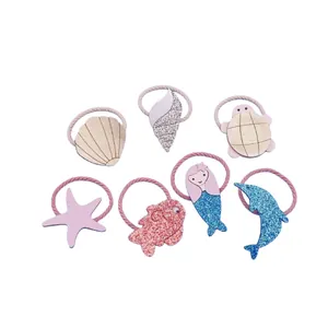 Cute set of ocean themed children's hair ties featuring glitter mermaid and shells