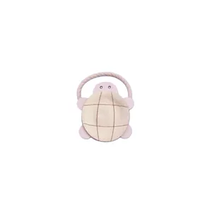 Detailed macro shot of a cute pink PU leather turtle charm hair accessory for girls