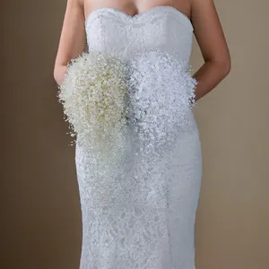 Exquisite handmade white and cream baby's breath bridal bouquets with elegant pearl details