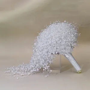 Elegant handmade cascading pearl bridal wedding bouquet with satin wrapped handle.