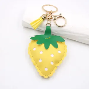 Cute yellow strawberry PU leather keychain with yellow tassel and gold metal clasp