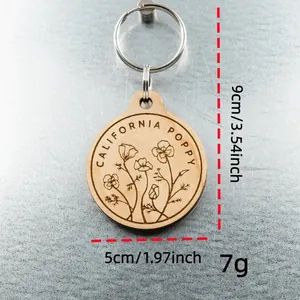 Detailed view of walnut wood engraved California poppy keychain with size specifications