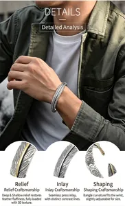Nahaufnahme der Gravur und Reliefkunst am Vintage-Feder-Manschettenarmband für Herren.